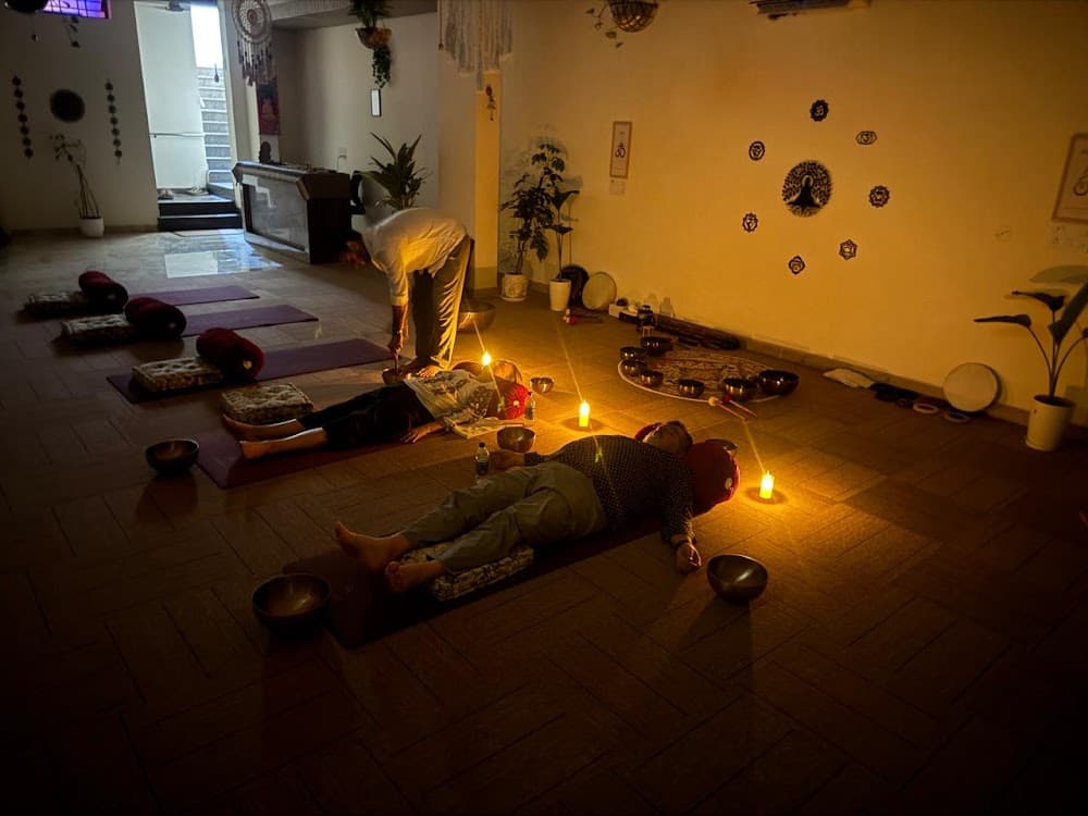 Singing bowls circle in candlelit haven