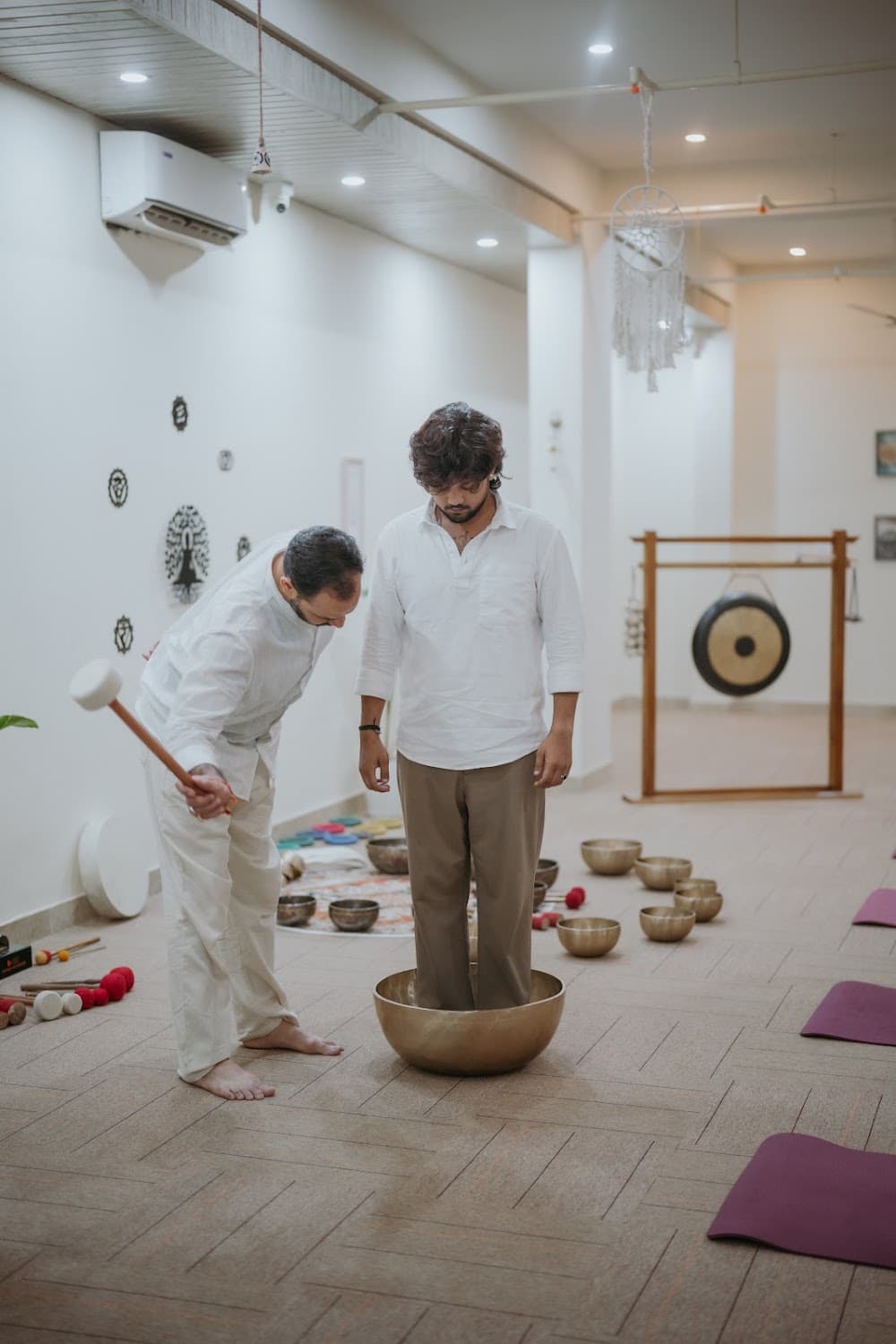 Group portrait with chakra wall art